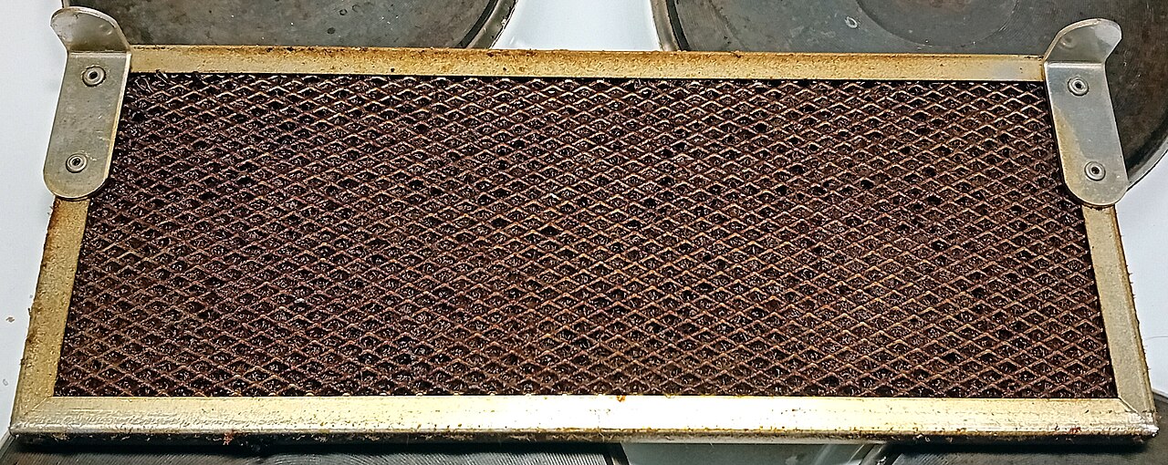 Grease and dust on a metal kitchen hood filter