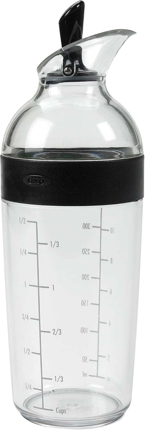 OXO 1.5-cup dressing shaker with dark lever and printed markings