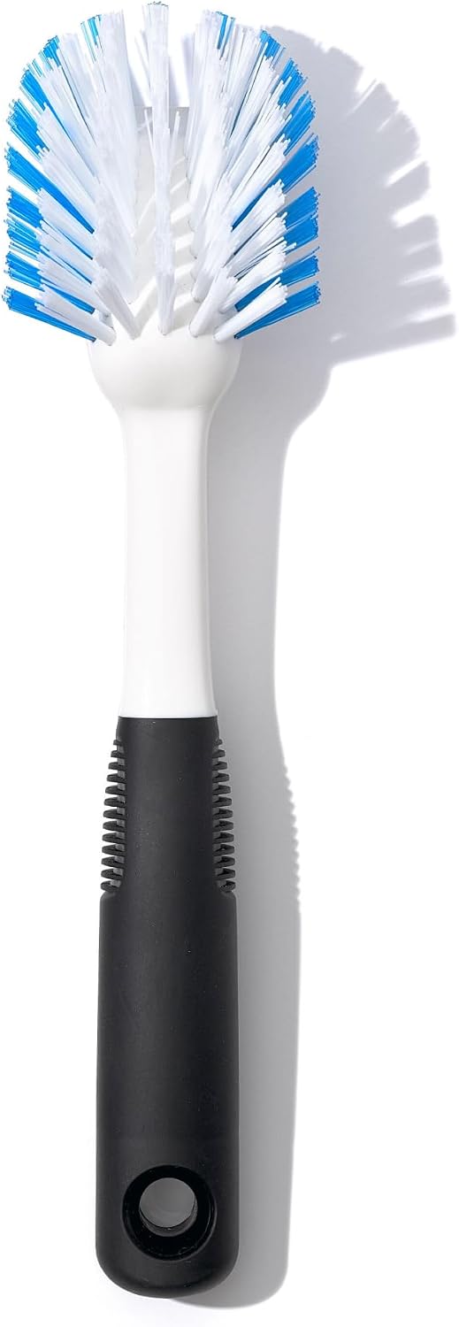 OXO plain dish brush with white and blue bristles and a dark handle