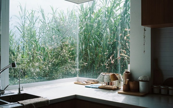 Small bright kitchen with a clear prep counter and sink, showing a practical amount of open workspace