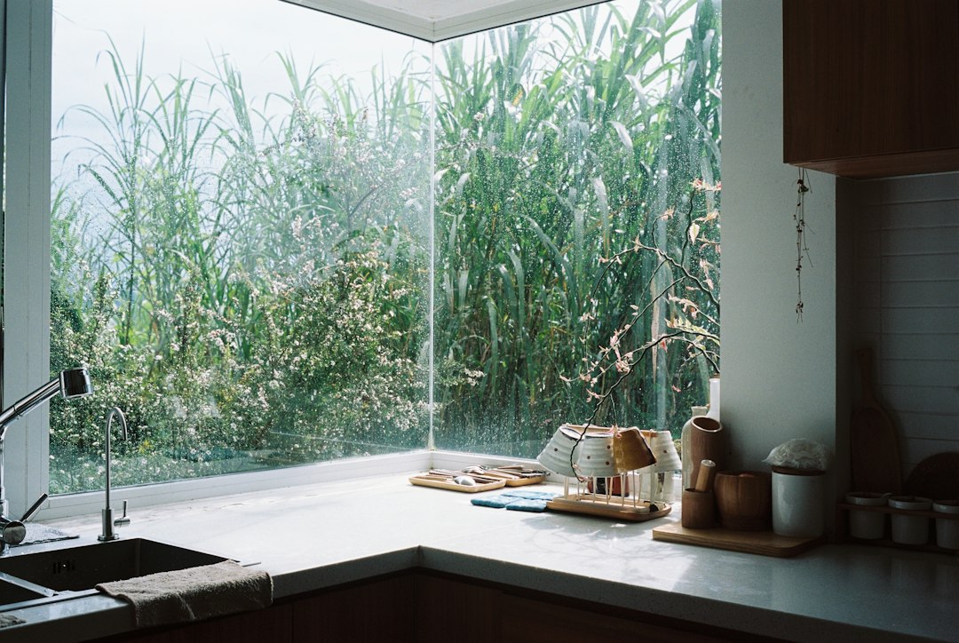 Small bright kitchen with a clear prep counter and sink, showing a practical amount of open workspace