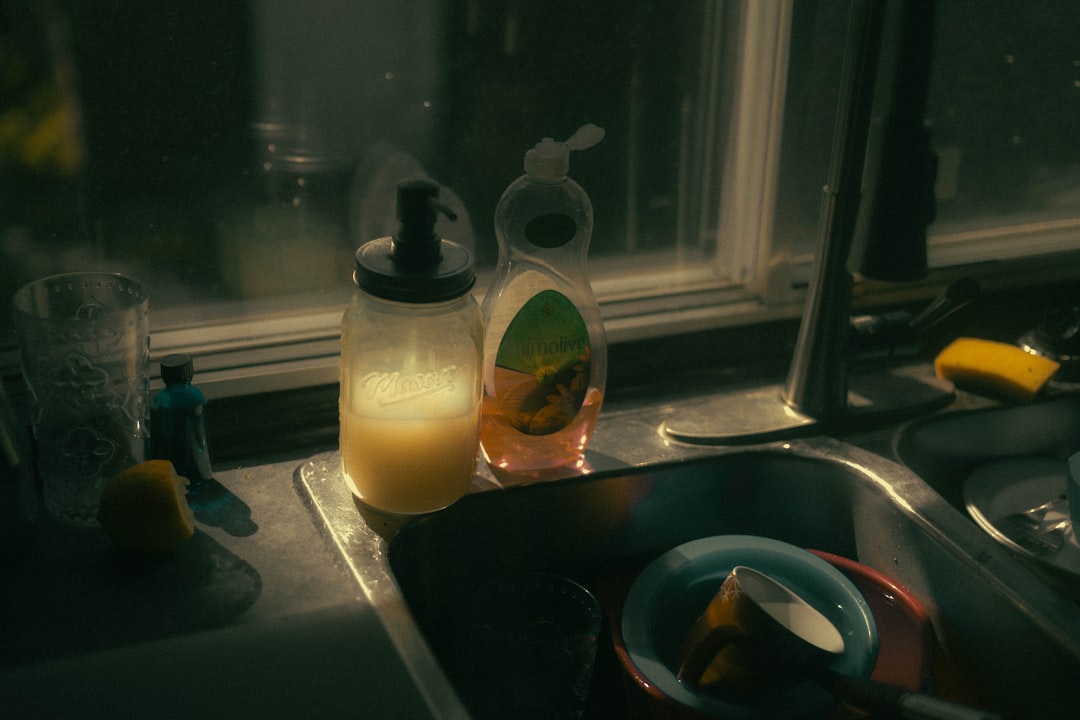Sink full of dirty dishes showing how quickly a small kitchen can feel crowded after everyday cooking