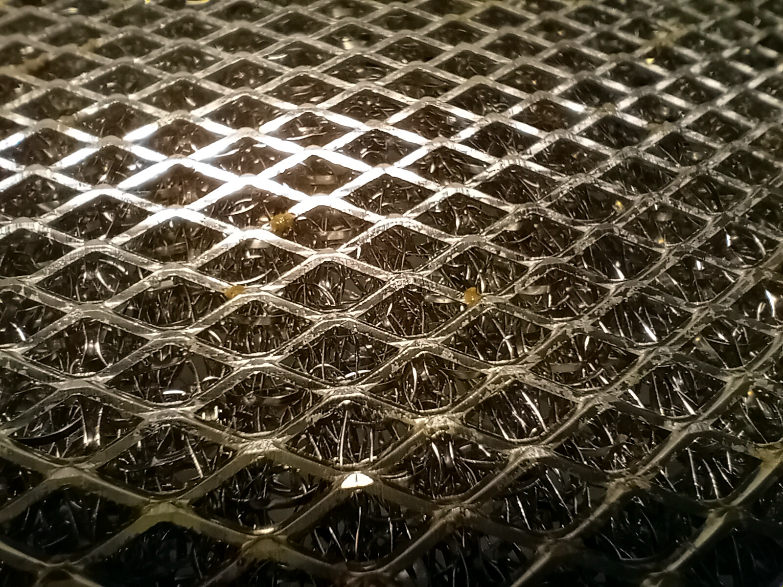 Close-up of a cleaned metal hood filter