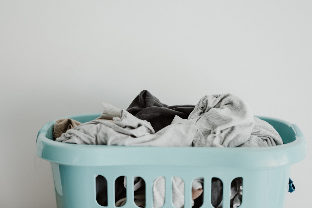 Laundry basket filled with clean clothes in a home, illustrating how laundry can become visible clutter in a small space