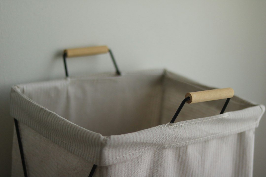 Laundry basket filled with clothes, representing a defined load in a simple family laundry routine