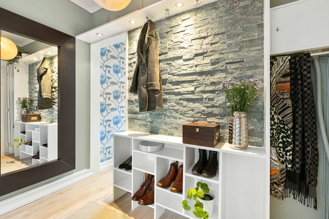Shoes stored neatly on an entryway shelf, illustrating odor control at a small home's entrance