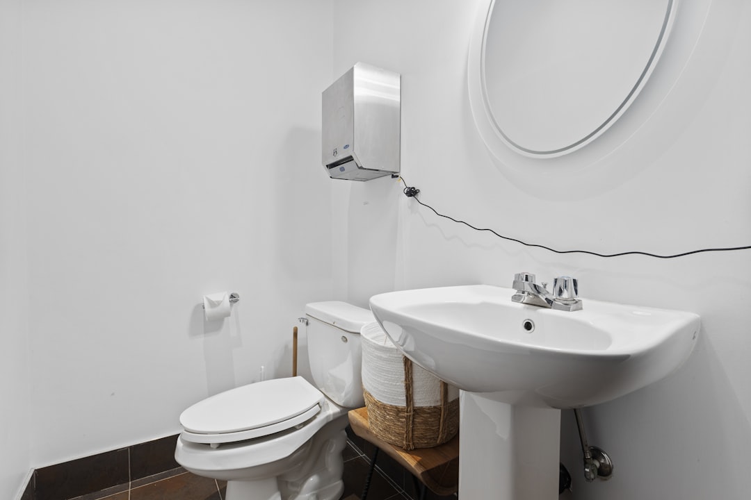 Small bathroom showing limited but usable wall and sink-area storage