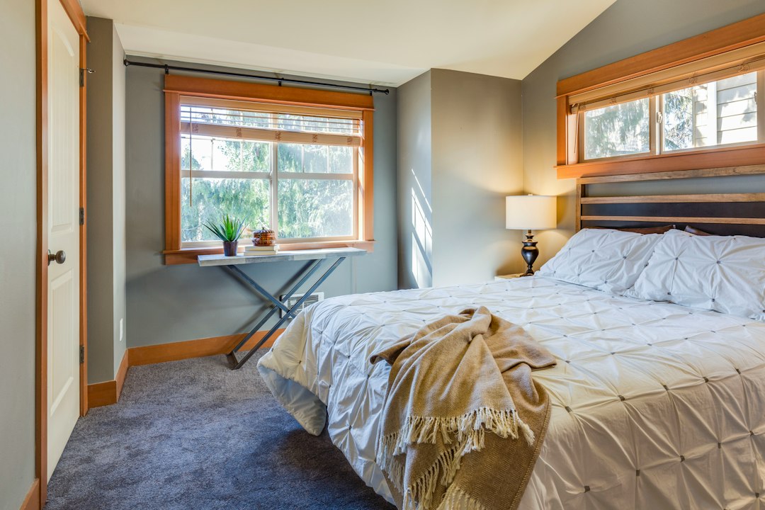 Bedroom with open floor space around the bed for easier cleaning
