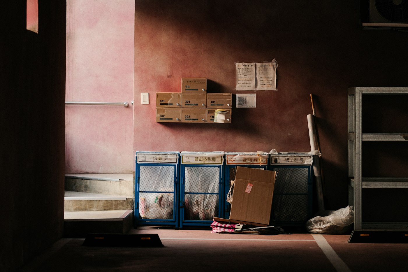 Cluttered workspace with cardboard boxes, illustrating how packaging can consume useful space