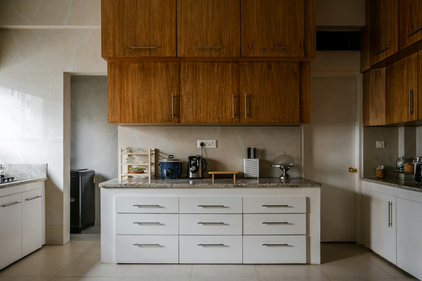 Compact kitchen counter and cabinets close to the main cooking zone