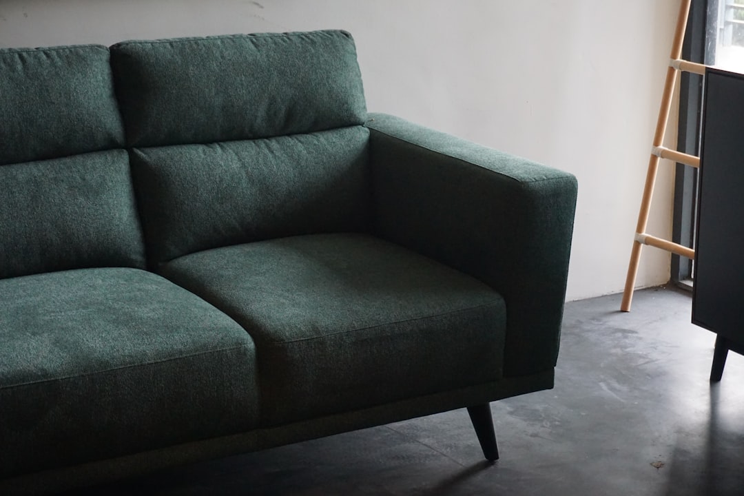 Upholstered armchair showing a fabric surface that requires care-specific cleaning
