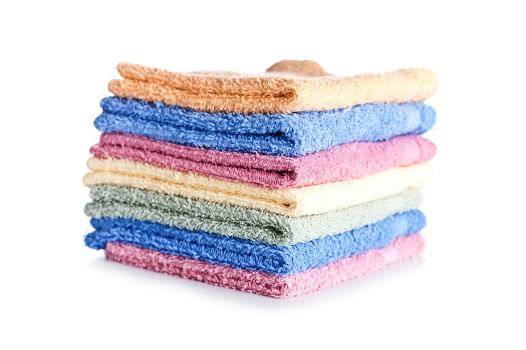 Stack of clean reusable cloths stored together for household cleaning