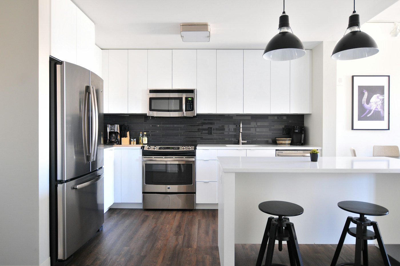 Compact kitchen with cabinetry that hides mixed household inventory