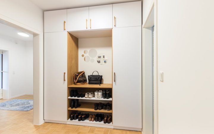 Entryway-style storage with coats and shoes contained in one vertical area