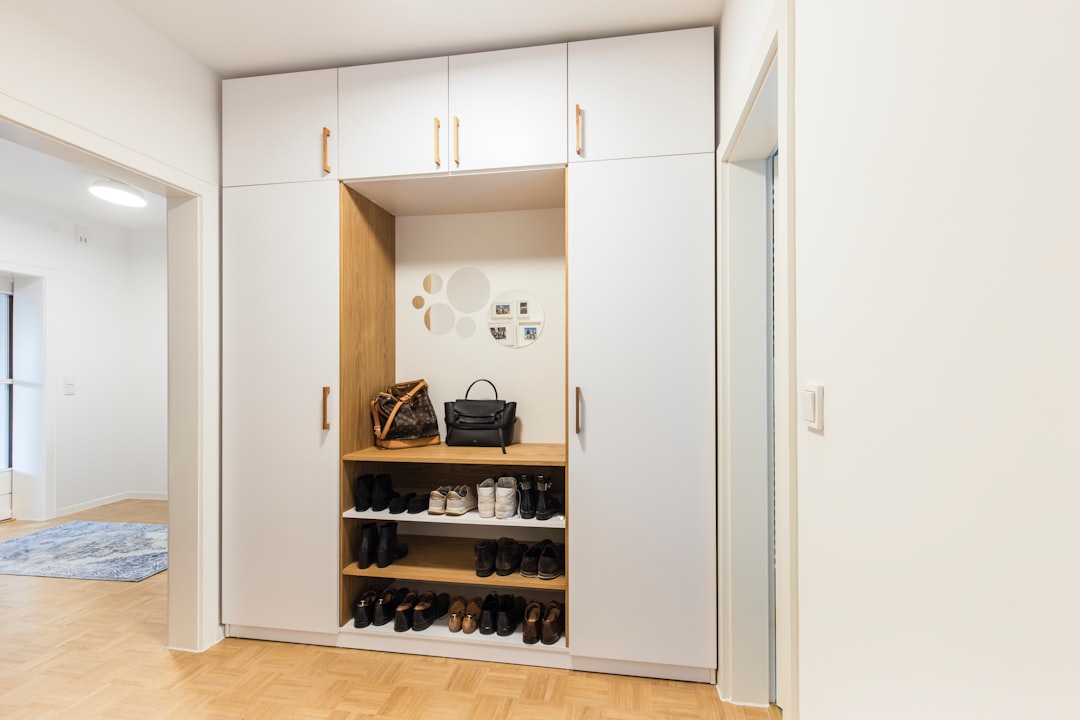 Entryway-style storage with coats and shoes contained in one vertical area