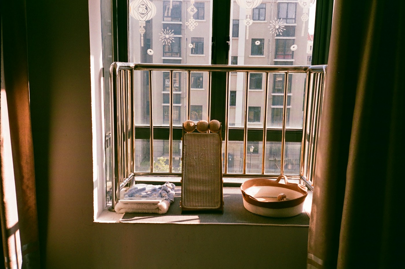 Objects on a windowsill with an exterior view