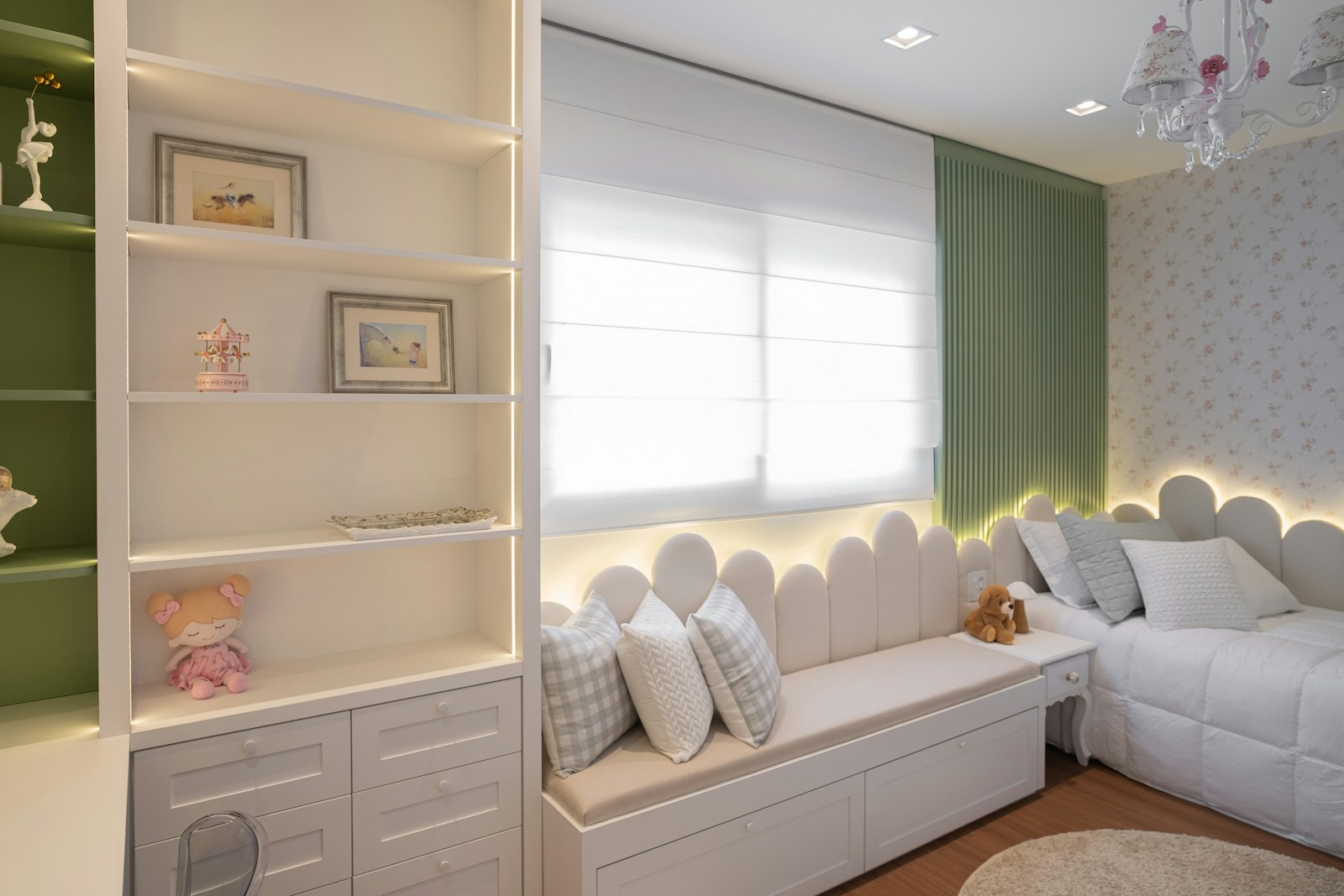A cozy bedroom with a window seat and shelves