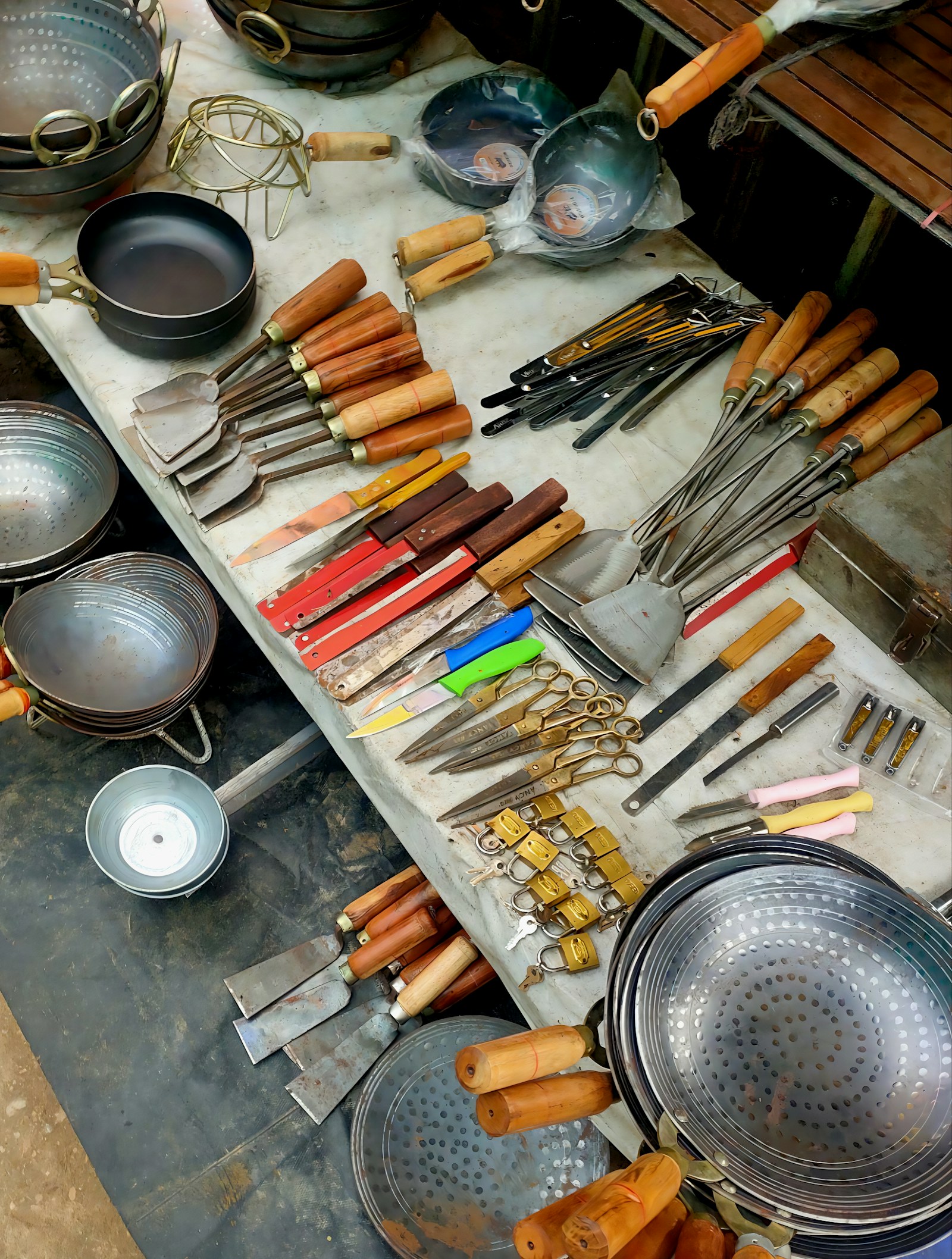 Assortment of kitchen utensils and cookware displayed on a table