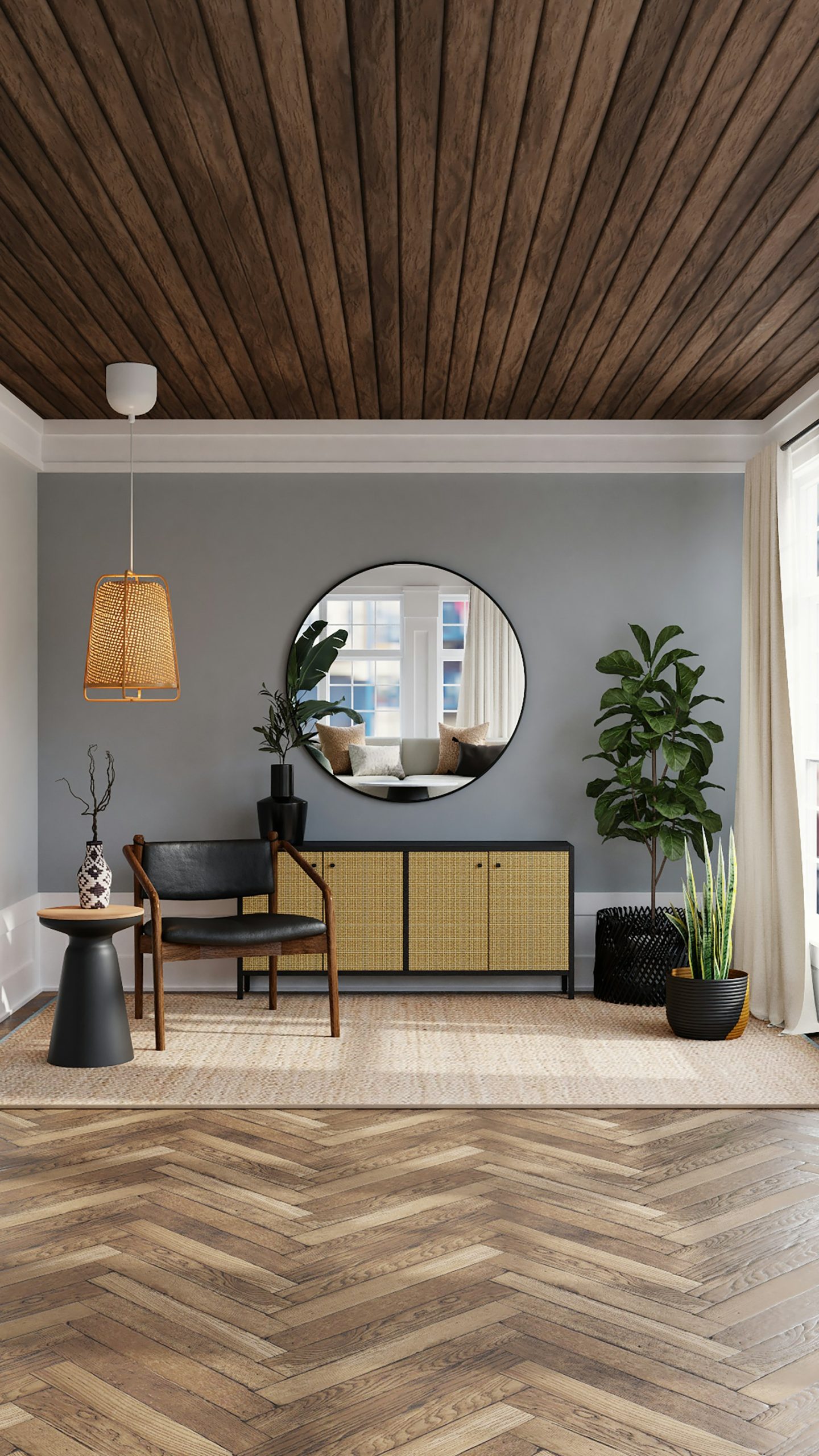 A living room with a black chair, rattan sideboard, and indoor plants