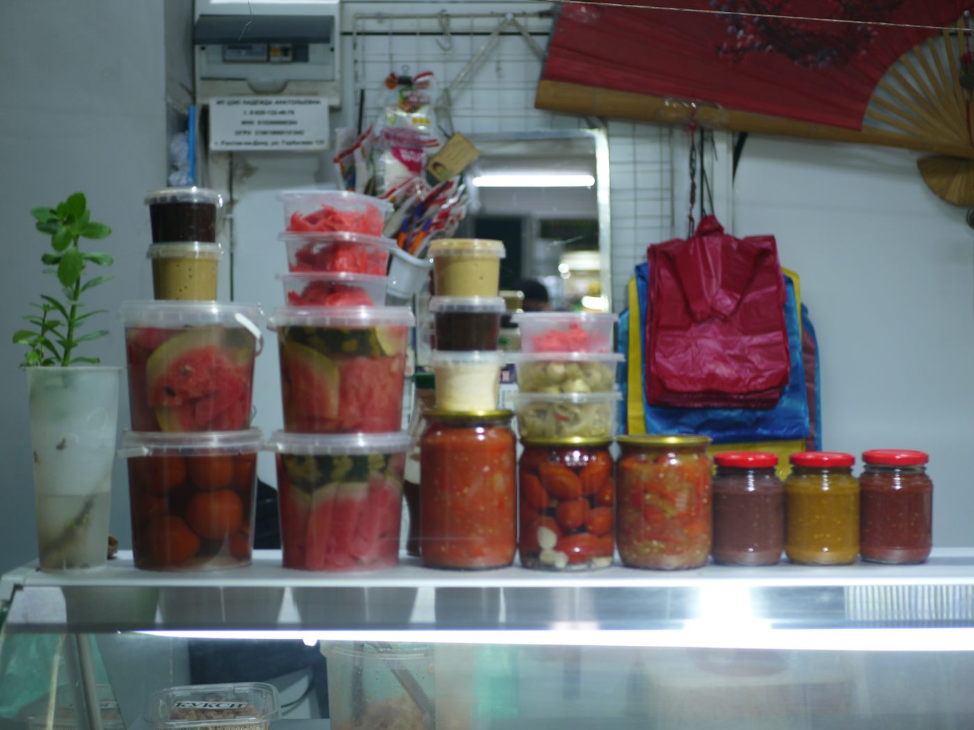 Jars and containers of preserved food on a shelf