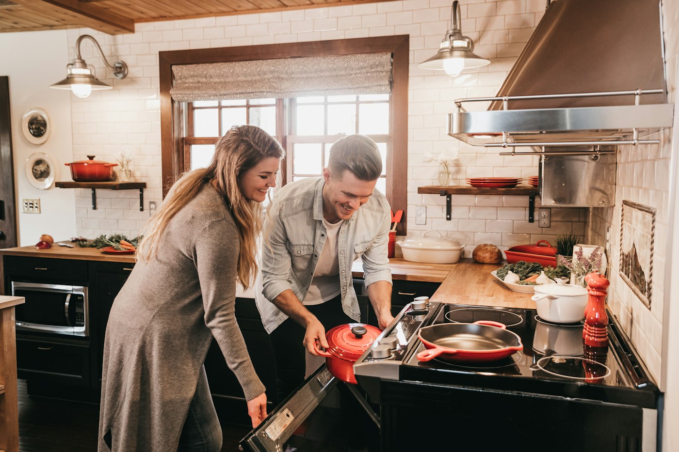 People cooking together in a compact kitchen where seasonings need to be easy to reach