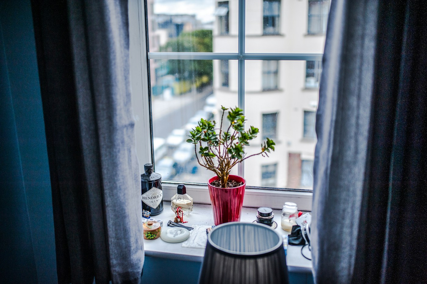 Close view of an apartment window and sill