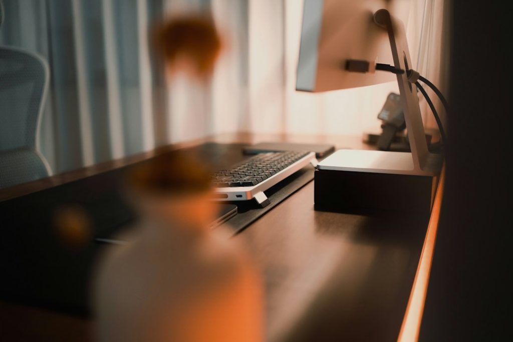 Desk with computer equipment and an open surface for active work