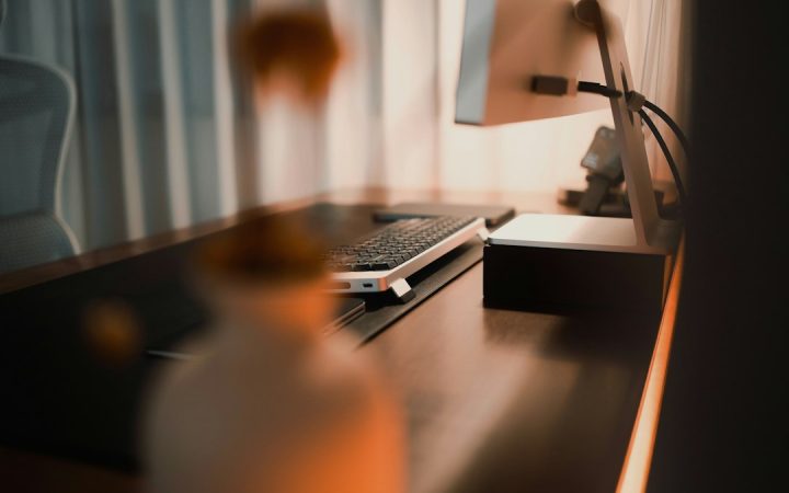 Desk with computer equipment and an open surface for active work