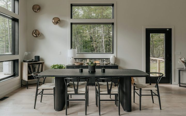 A dining room with a table and chairs