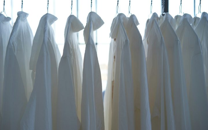 white dress shirt hangign on clothes