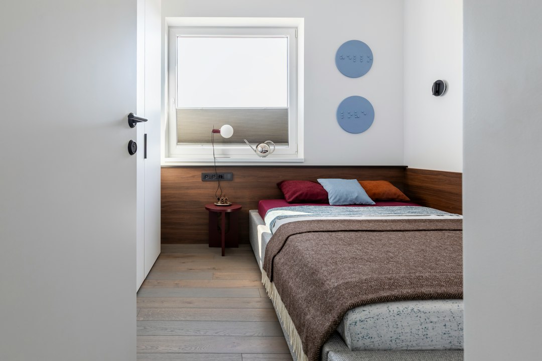Compact bedroom with a clear walking path and controlled furniture footprint