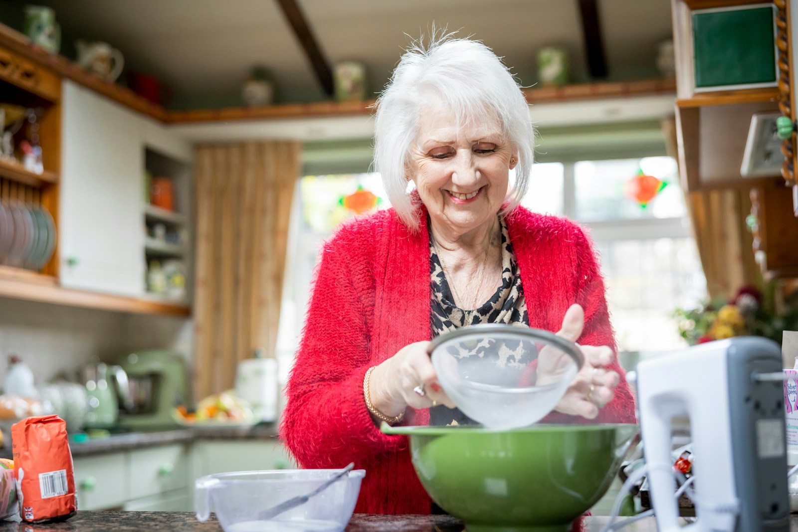 Person preparing ingredients in mixing bowls