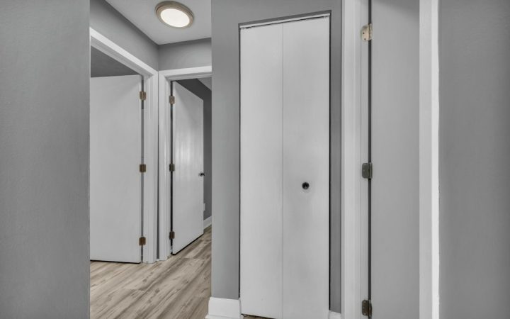 Narrow apartment hallway showing why bulky gear needs a defined parking area