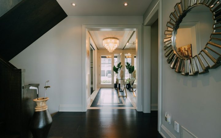 Narrow hallway with mirror and open circulation that can support a compact entry system