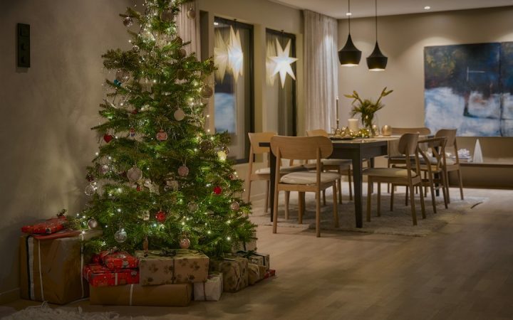 Christmas tree used as the primary seasonal focal point in a living room