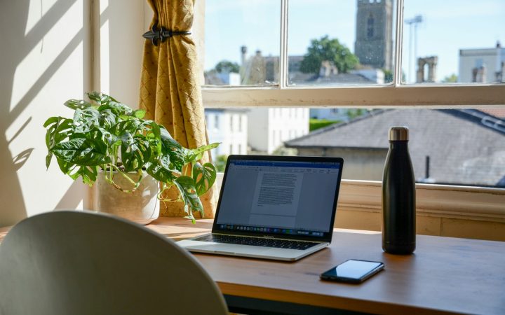 Compact home office desk with laptop and work setup