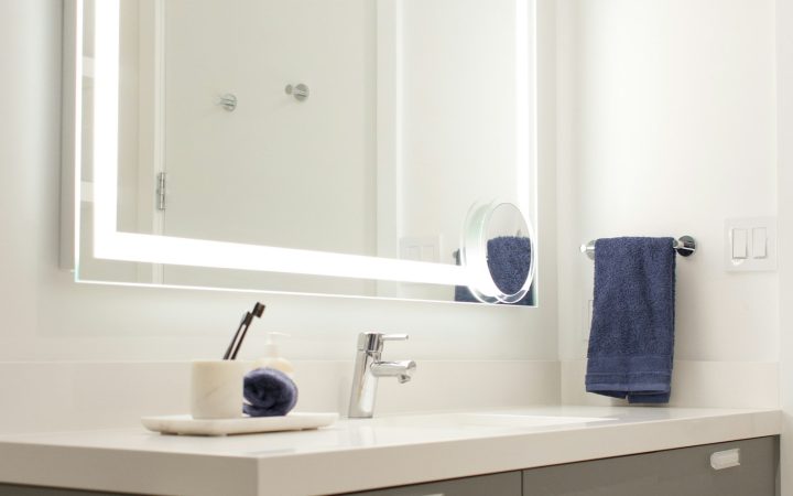 Bathroom vanity with an illuminated mirror