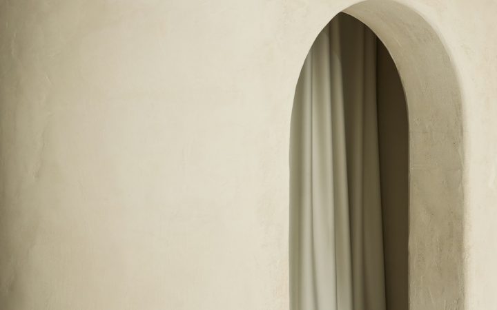 Curtain hanging inside an arched opening