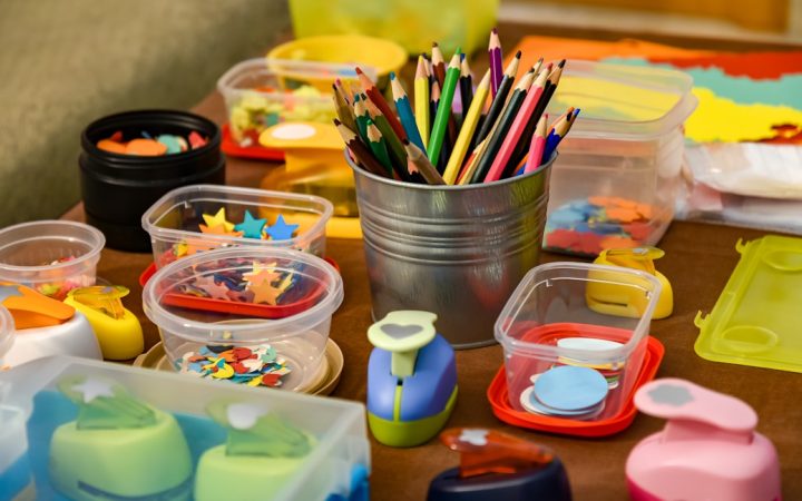 Craft table with colorful art materials ready for a children’s project