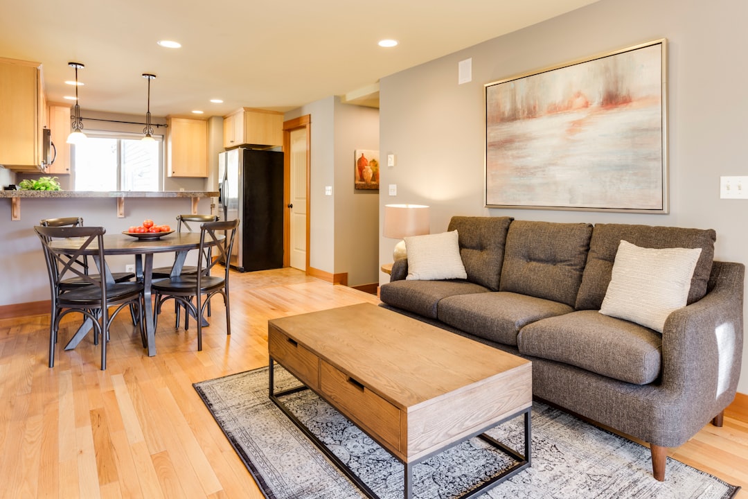 Living room with sofa and open floor area ready for a focused seasonal cleaning session