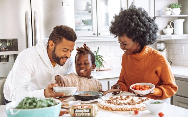 Adults together at home during a relaxed evening family routine
