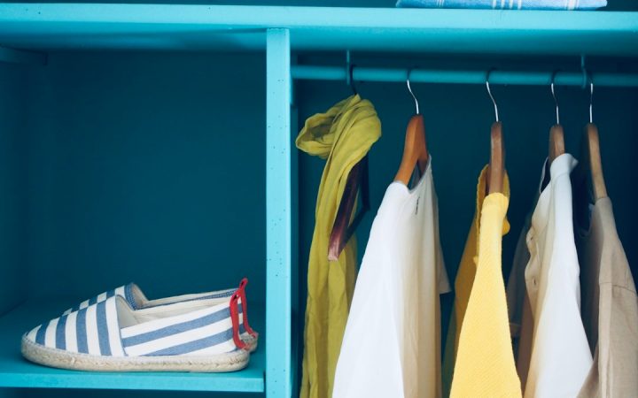 Closet with hanging clothing and contained storage zones