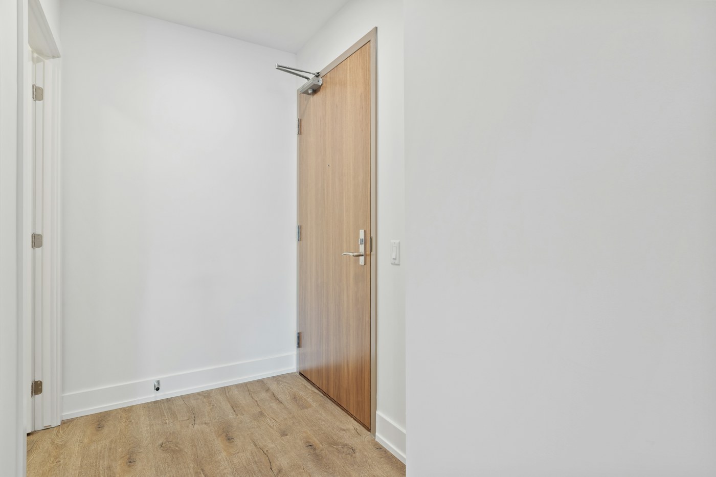 Small entry area with limited wall and floor space for active family gear