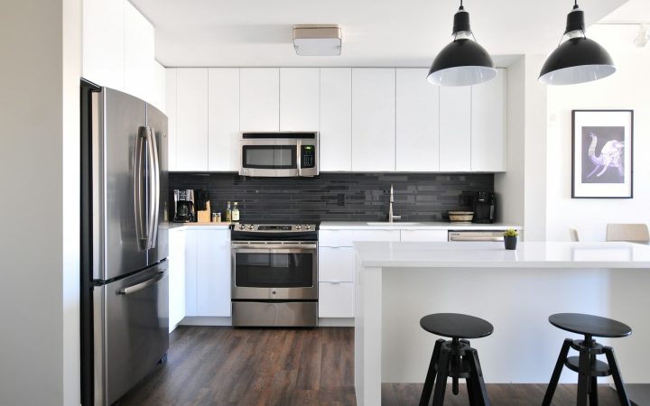 Small organized kitchen with cabinets used efficiently
