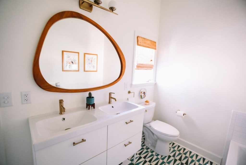 Compact bathroom with visible towel storage and limited floor space