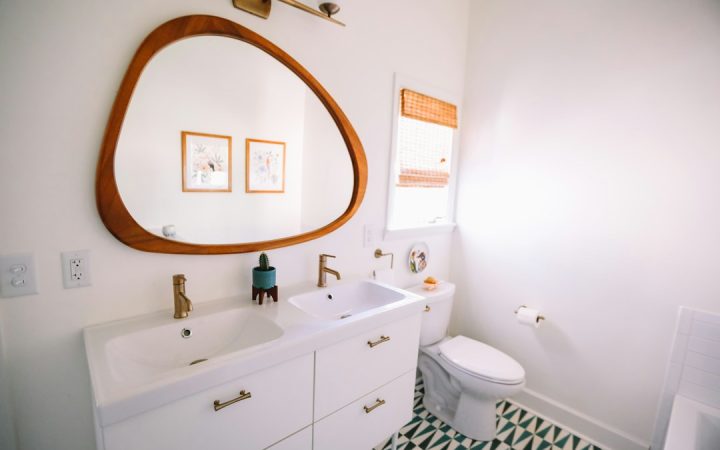 Compact bathroom with visible towel storage and limited floor space