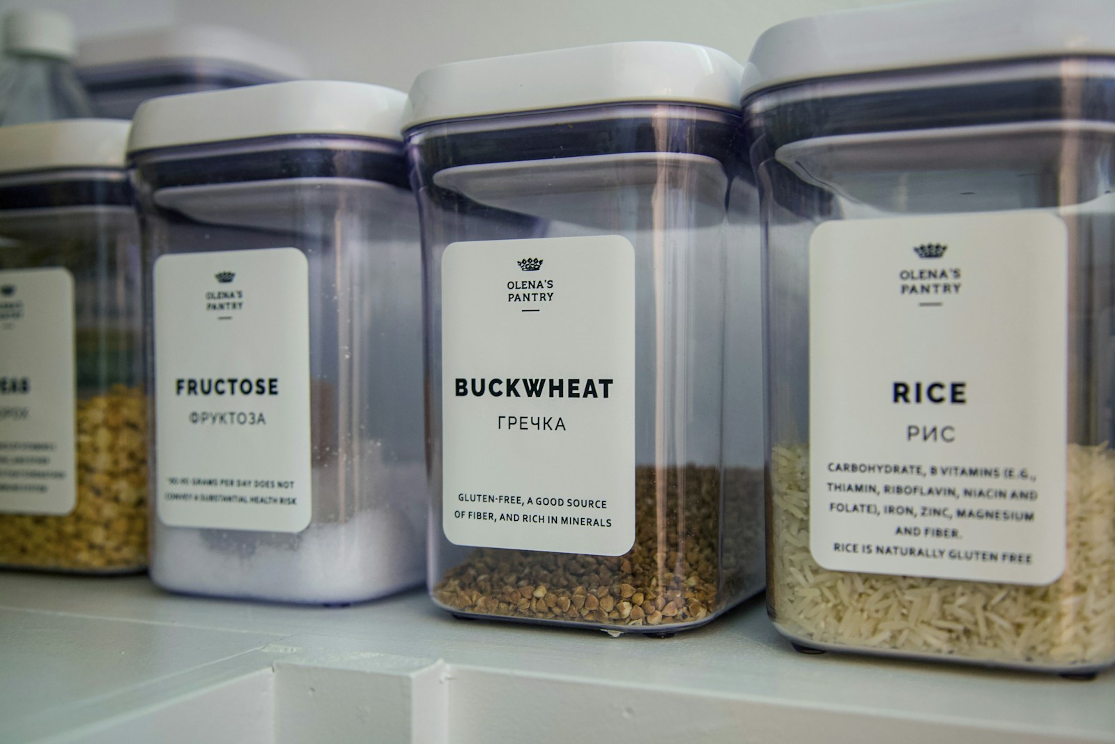 Labeled dry-ingredient containers on a shelf