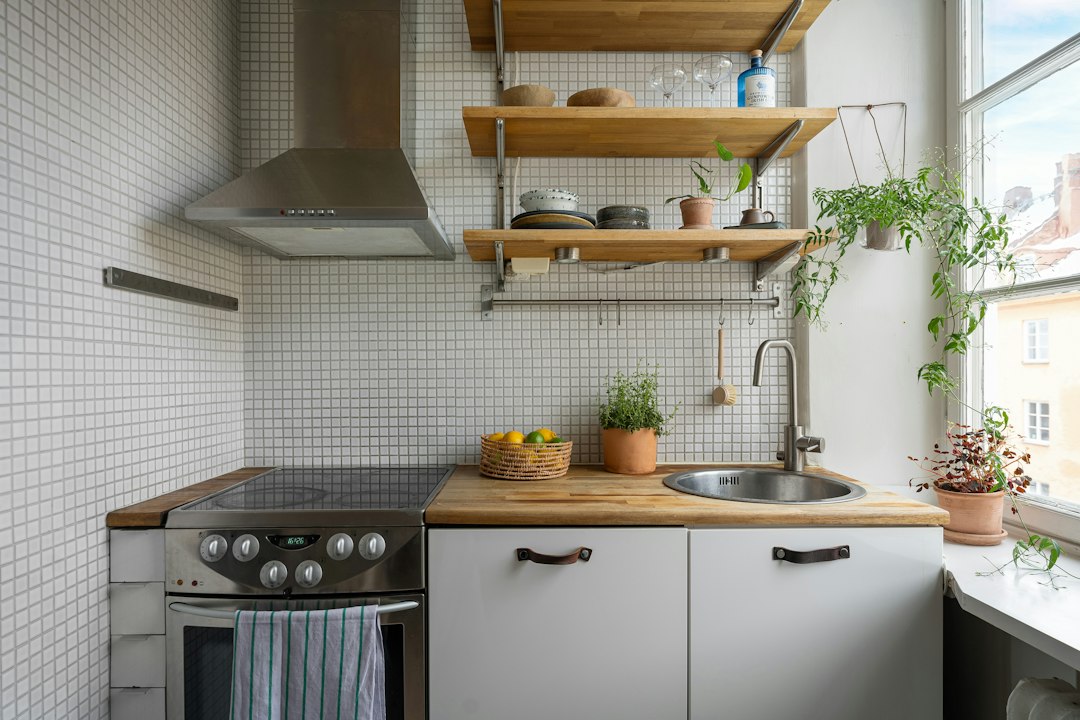 Floor area directly in front of a compact kitchen stove and counter