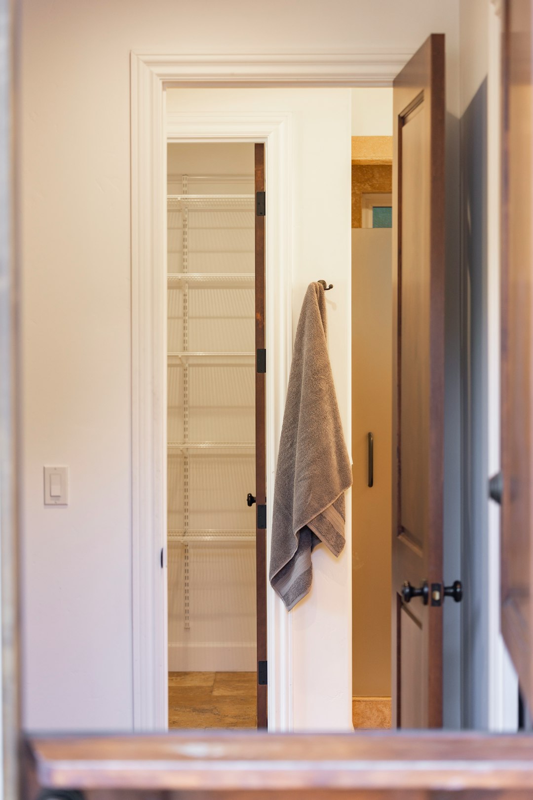 Towel and shelving area illustrating compact linen storage