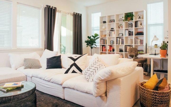 Comfortable living room showing pillows and blankets within a defined seating area